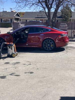 Car coming out of tunnel being dried.