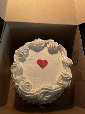 Chocolate cake with whipped frosting and a heart