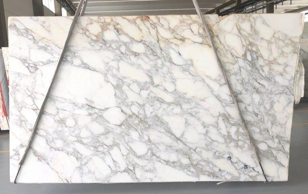 3cm Calacatta Borghini is an Italian elegant white marble with deep gray veining and taupe/gold deposits. Visit us today 11125 Zodiac Lane -