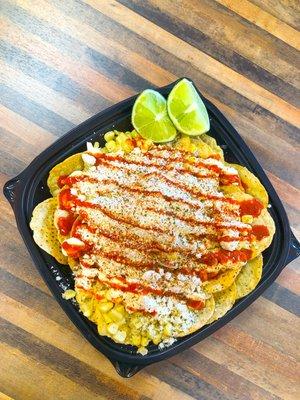 Tostielote - Corn, Mayonnaise, Cheese, Lime, Hot Sauce, and Tajin. Served with your choice of chips!