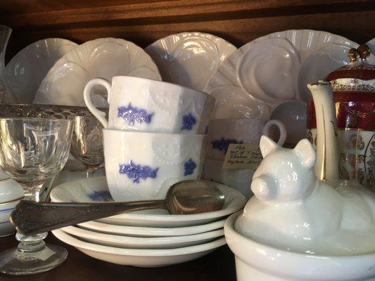 Antique English Blue Chelsea cups and saucers. Antique Limoges oyster plates in the back.