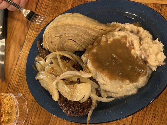 Beef liver and onions with mashed potatoes and cabbage