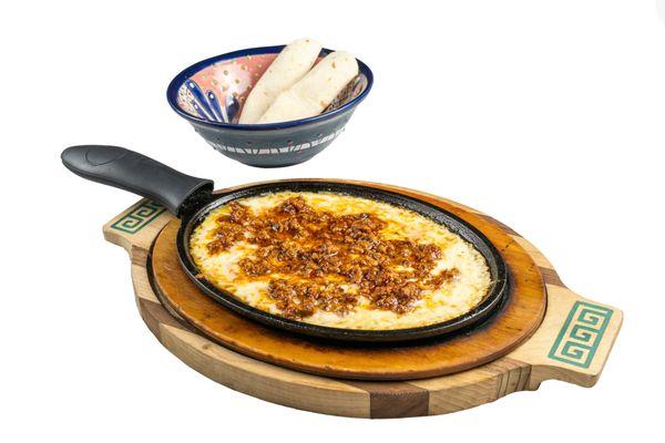 Bubbling hot melted cheese served and topped with chorizo. Add 3 flour or corn tortillas for an additional charge.