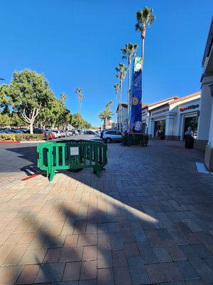 Cherry Orchard Shopping Center - car ran up onto sidewalk and hit the obelisk... destroyed a lamp post & damaged obelisk