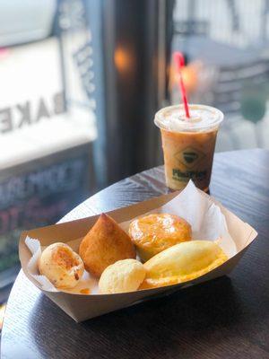 cortado coffe. left to right: [top] pão de queijo, coxinha, empada [bottom] empanada