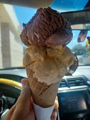 Double dip rocky road and vanilla waffle cone.