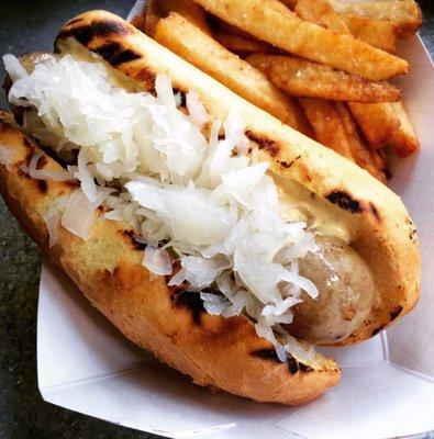 Housemade bratwurst with sauerkraut and mustard