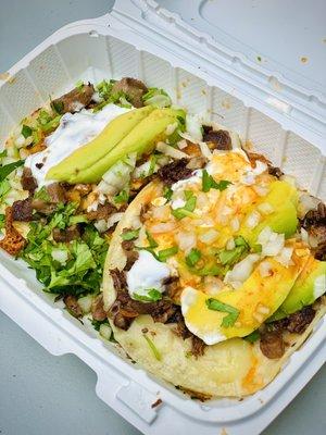 Left: super taco de lengua (beef tongue) // Right: super taco de cabeza (cow's head)