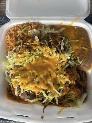 Combo- shredded beef tostada and shredded chicken enchiladas with beans and rice