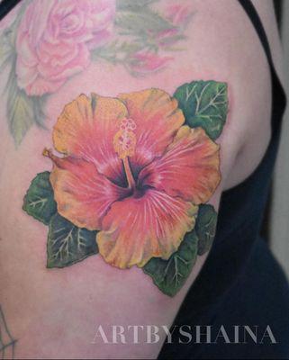 Realistic hibiscus flower tattoo. Bright color, yellow and pink.