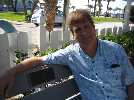 Me, sitting on the bench in memory of my uncle, John J. Gill, volunteer, docent and friend.