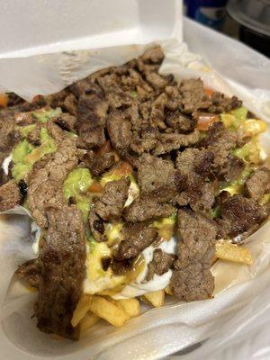 Carne asada fries: cheese sauce, sour cream, guac