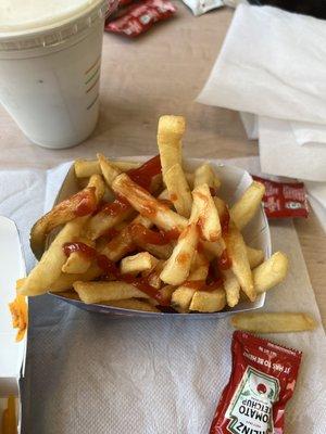 Hot French fries with done added ketchup. Yes please