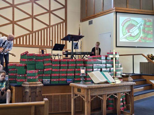 Collecting boxes for those less fortunate from church members.