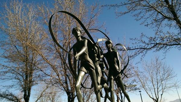 Statue of ribbon dancers outside the health and lifetime activities center