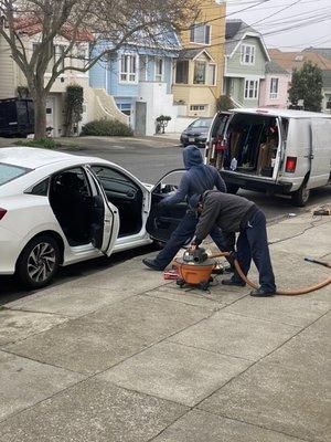 Their staff in front of my garage to fix the damages.