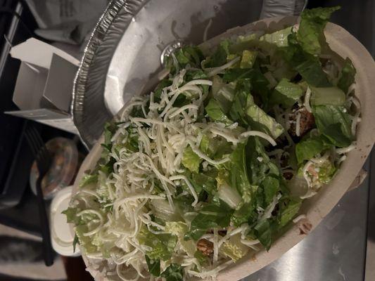 Rice bowl with carne asada steak, corn salsa, cheese, lettuce and sour cream.