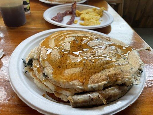 Blueberry pancakes, sausage, bacon, eggs