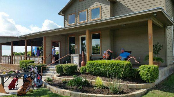 Patrons relaxing and enjoying the new stone work around the flower beds at the clubhouse