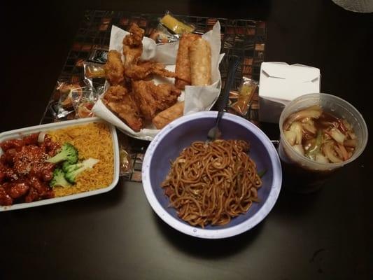 Sesame chicken combo, fried chicken wings, egg rolls, house special chow mein