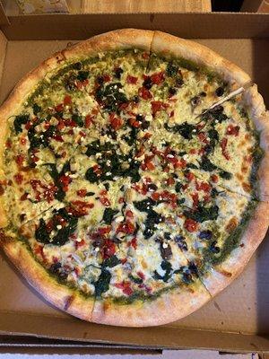 Pesto primavera pizza (kalamata olives, roasted red peppers, feta, spinach, and pesto)