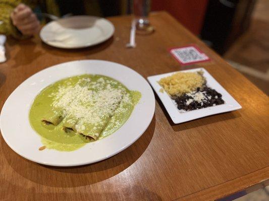 ENCHILADAS de HUITLACOCHE with side of rice and beans.