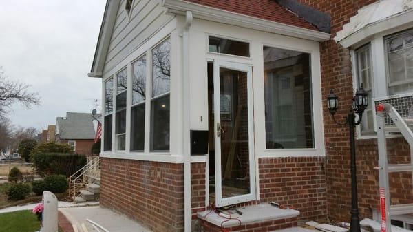 Installed R5.6 vinyl double hung windows U-value 0.18, and picture window. Exterior finished with vinyl boards. (Side 1)