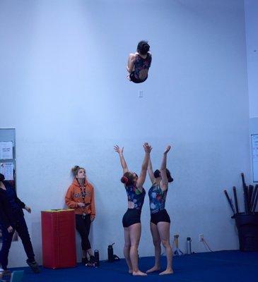 Phylisha, Alison, and Kaylee practice their basket toss.