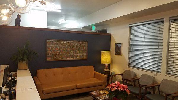 Just like home...mid-century modern vibe, vintage furniture . And my trademark, original art sourced locally