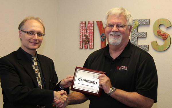 Pat Myles (owner) Receiving our HEB Chamber of Commerce plaque.