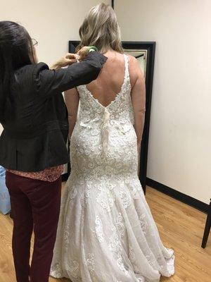 Kim had to practically remake the dress!  She did a phenomenal job!  Kim kept making adjustments until it was absolutely perfect!