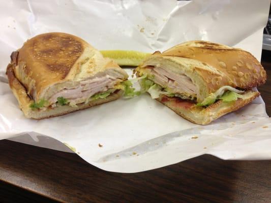 The "ROB" turkey sandwich which comes with lettuce, tomato, American cheese, bacon, and mayo on French bread.