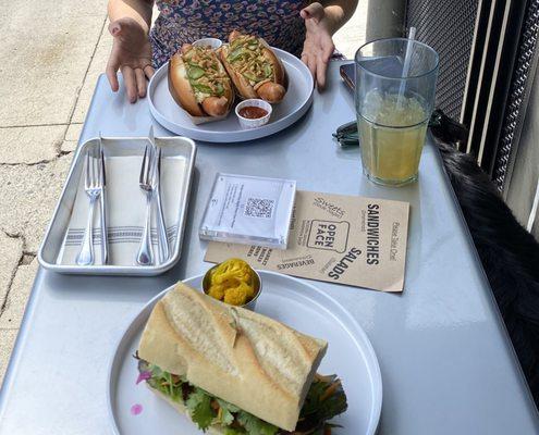 Bahn mi, great dane dogs, shrub, outdoor dining