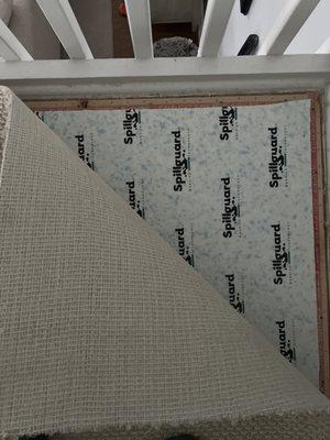 Carpet at the staircase landing not secured.