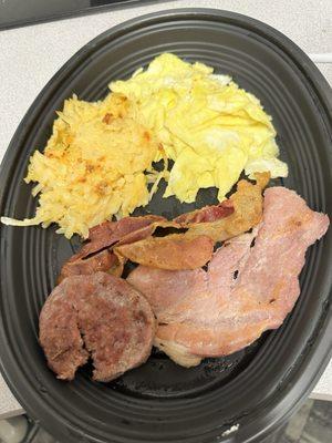 Scrambled eggs, hash brown casserole, and meats