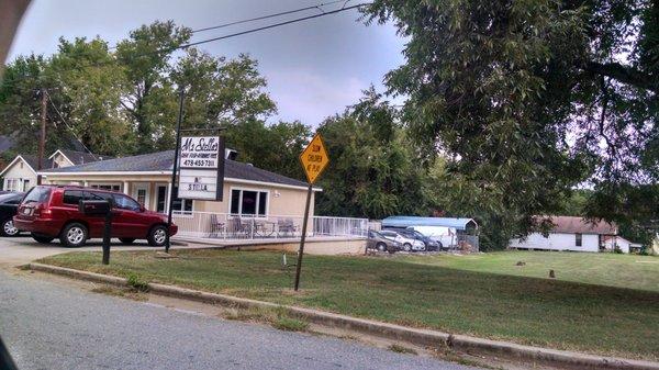 The restaurant is on the corner. Baked chicken. Beans and collards. Key lime pound cake.