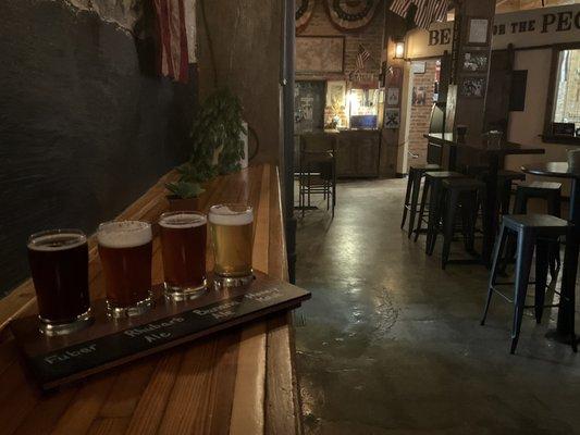 Inside the taproom with flight of 4.