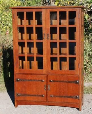 Large four door vintage L. & J.G. Stickley strap-hinge cabinet.