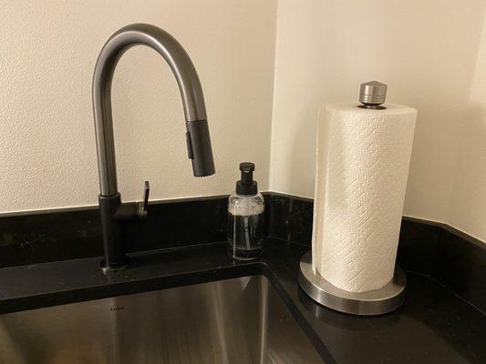 Laundry room sink with quartz surround.