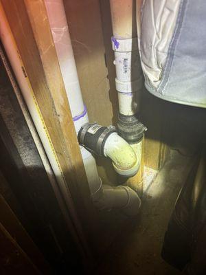 Pipe with (2) fernco boots to easily flush elbow to remove clogs , 700 plus in flushing that ?