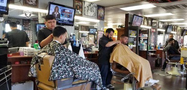 3 barbers doing there thing..