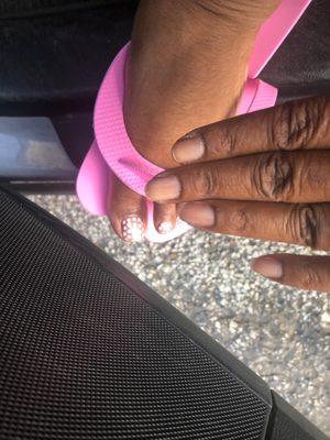 I'm in the parking lot. Toes are great but do these nails look like they were manicured? She was going to paint this! I'm good.