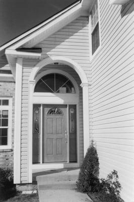 New vinyl Siding, and trim around entrances and overhangs.