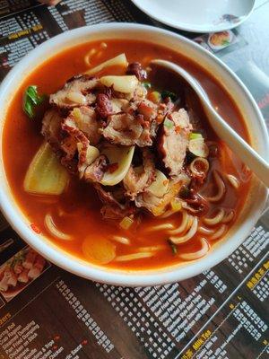 Spicy noodles soup with sliced intestines