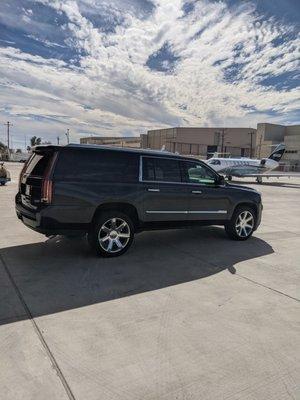 Late model Cadillac escalade ESV , picking up client at Goodyear Airport