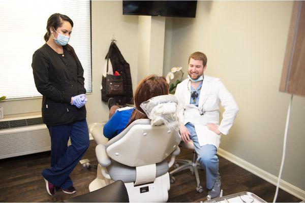 Dr. Wyne having a friendly conversation with a patient.