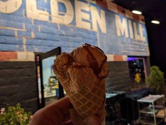 Salted butter caramel ice cream in a waffle cone.