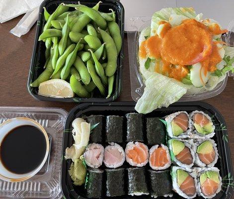 Kiku Dinner Set with salad, edamame, yellowtail, salmon, and salmon avocado rolls