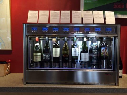 Fancy wine dispenser. Choose small, medium, or large. It shows the price per pour.