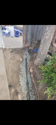 We put 3/4 crushed rock in the trench with rebar to secure the pipe